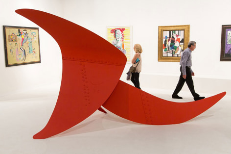 Installation view of Art Basel | Miami Beach 2013, booth B01 featuring a large scale sculpture by Alexander Calder composed of three metal sheets all painted in red in shape of slightly curvy triangular, of large, medium and smaller sizes, all connected together, the sculpture is called, Brontosaurus and was made in 1970. The materials are, painted metal stabile, the dimensions are  213 x 152 x 365.8 cm. (84 x 60 in. x 144 inches). Photography by Karen Fuchs.  &copy; 2018 Calder Foundation, New York / Artist Right Society (ARS), New York. &copy;Helly Nahmad Gallery NY.