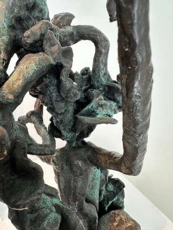 Close-up image of organic abstract bronze sculpture titled Woman Dancing About Trees by Yulla Lipchitz.