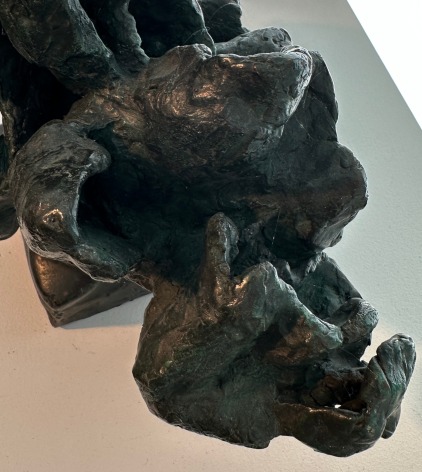 Detail close-up image of Yulla Lipchitz on bronze sculpture of a snake and bird.