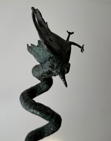 Detail close-up image of Yulla Lipchitz on bronze sculpture of a snake and bird.