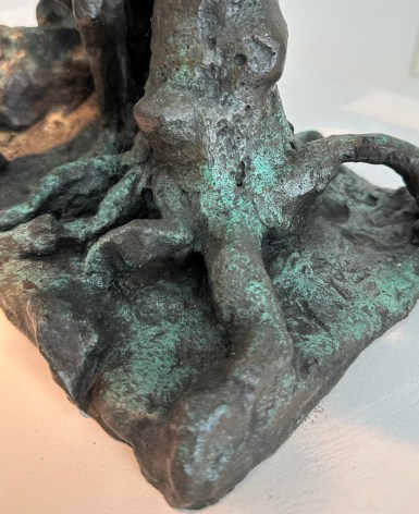 Close-up image of organic abstract bronze sculpture titled Woman Dancing About Trees by Yulla Lipchitz.