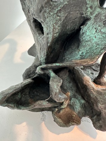 Close-up image of organic abstract bronze sculpture titled Woman Dancing About Trees by Yulla Lipchitz.