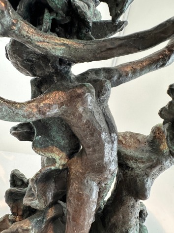 Close-up image of organic abstract bronze sculpture titled Woman Dancing About Trees by Yulla Lipchitz.