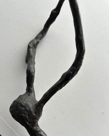 Close up image of bronze sculpture titled Snake &amp; Bird on Branch #2 by Yulla Lipchitz.