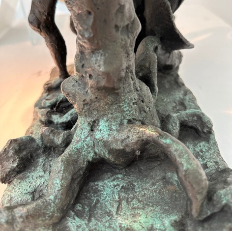 Close-up image of organic abstract bronze sculpture titled Woman Dancing About Trees by Yulla Lipchitz.