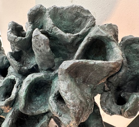 Close up image of detail of bronze sculpture titled Snake &amp; Bird on Branch #2 by Yulla Lipchitz.