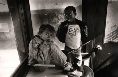 Eli Reed,&nbsp;Child residents hanging out in security shack, Pink Palace housing project, San Francisco, 1981
