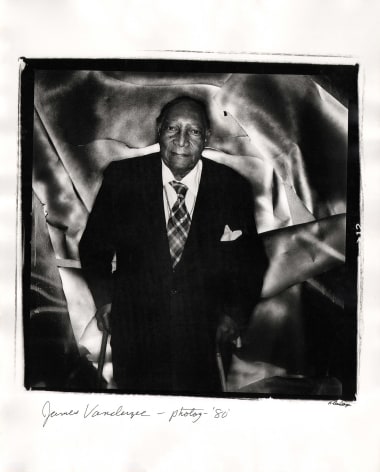 Anthony Barboza, James Van Der Zee - Photographer, 1980. Subject stands in the center of the square frame supported by two wooden canes against a shiny and textured backdrop.