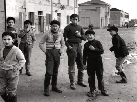 Nino Migliori, Delta People, 1958. Seven boys on the street looking to the camera.