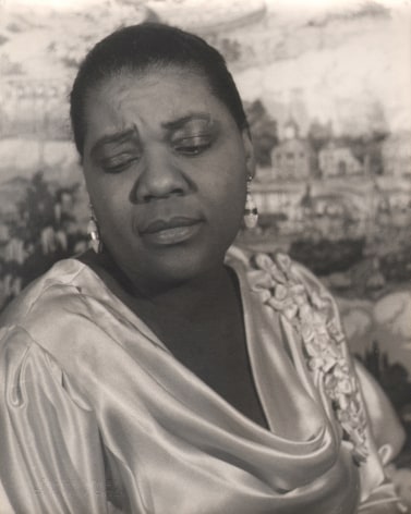 07. Carl Van Vechten, Bessie Smith, 1936. Bust-length portrait of the subject in silk with eyes downcast.