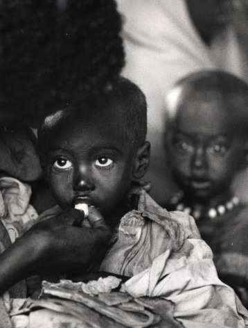 Faces In Emergency Camp: Children as they were being fed by the surviving parent, or parents in a dislocation camp in&nbsp;Ethiopia.
