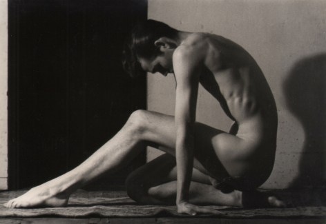 PaJaMa, John B., ​c. 1945. Nude male figure seated in profile facing left, back hunched, arms straight down to the floor, one leg beneath him and one extended out in front of him.