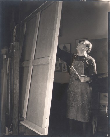 George Platt Lynes, Pavel Tchelitchew, n.d. Subject is standing before an easel, painting.