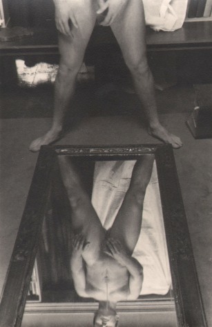 PaJaMa, Jensen Yow, ​c. 1945. Nude male figure standing above a mirror, feet spread to the mirror's bottom corners. Full body is seen in the reflection; only the lower body above.