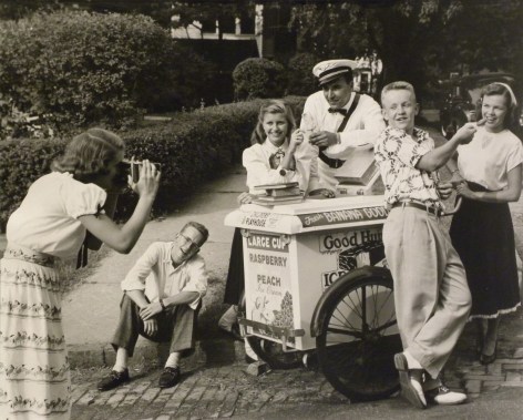 Ralph Bartholomew, Advertisement for Eastman Kodak, c. 1947. A group of teens poses around an ice cream cart with the male vendor as a young woman photographs them from the lower left of the frame.