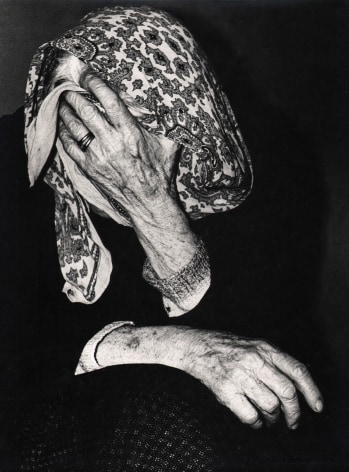 08. Mario Giacomelli, Verr&agrave; la morte e avr&agrave; i tuoi occhi, 1966&ndash;1968. High contrast image. Seated woman covers her face with a hand and kerchief.