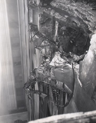 05. Acme Newspictures, Plane Wreckage Clings to Empire State Building, ​1945. Close-up of damaged building facade with metal protruding from the hole.