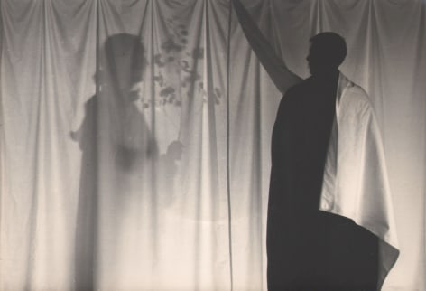 PaJaMa, Margaret French, Paul Cadmus, Provincetown, ​c. 1945. Two silhouettes on either side of a backlit white sheet. The left figure holds a small branch with leaves.