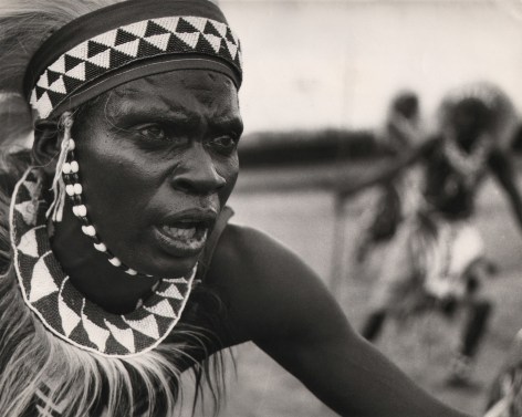 07. Derrick Knight, Watutsi Dancer, Ruanda Urundi, c. 1959. Close-up of the face of a traditionally costumed Watutsi dancer, looking off to the right of the frame.