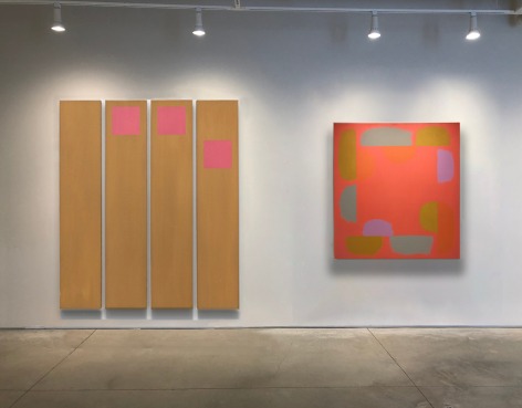 A painting by Doug Ohlson comprised of four panels painted tan with pink squares next to another painting by Doug Ohlson with a salmon ground and forms in olive, teal and purple flanking the edge of the square canvas