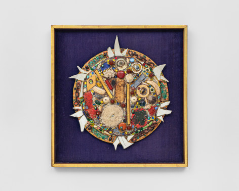 A congregation of glass eyes, mirror fragments, links from chains, seashells, and found objects arranged in a circular format.  Mounted and framed on a purple velvet backing and gold frame