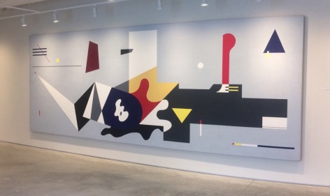 A large abstract mural with geometric and biomorphic forms on a light grey ground