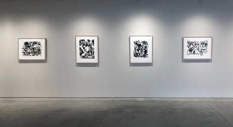 Four screenprints by Jackson Pollock, black and white, framed on a white wall.