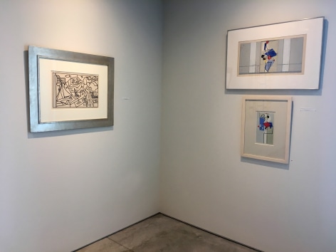 Three paintings installed on a white wall at the Washburn Gallery