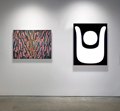 A painting by Myron Stout in pinks, blues, purples and yellows and blacks next to a black and white painting by Myron Stout