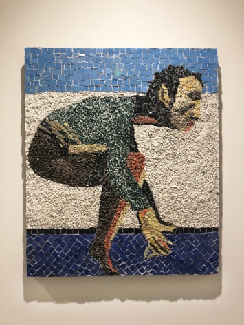 Blue, white, black, yellow, orange and green mosaic tiles form a crouched figure depicting the danger Merce Cunningham