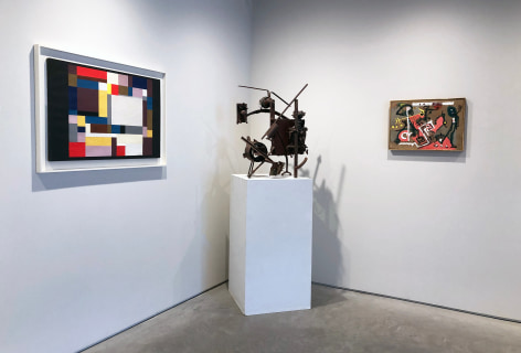 Two paintings and a sculpture installed in the corner of the Washburn Gallery