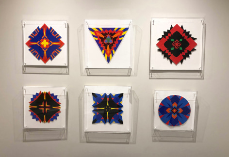 Six works on paper by Jack Youngerman in red, black, blue, yellow orange and green installed on a white wall