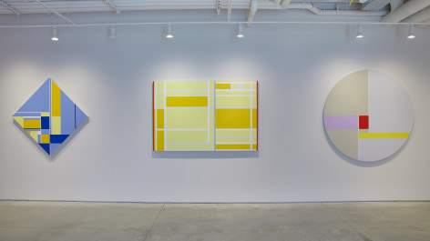 Three paintings installed in the Washburn Gallery