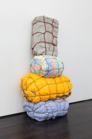 Maia Ruth Lee, Bondage Baggage Prototype 4, 2018, Sculpture, Tarp, rope, tape, luggage, used clothing, and bedding, 170.2 &times; 88.9 &times; 53.3 cm. Courtesy of the artist &amp;amp; PKM Gallery.