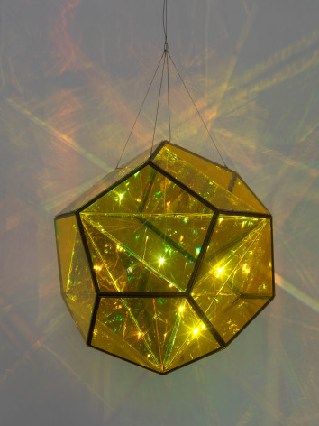 Olafur Eliasson, Your polyamorous sphere, 2022. Coloured glass (yellow, blue), colour-effect filter glass (green), stainless steel, paint (black), LED light, aluminium, 120 cm diameter. Courtesy of the artist &amp;amp; PKM Gallery.