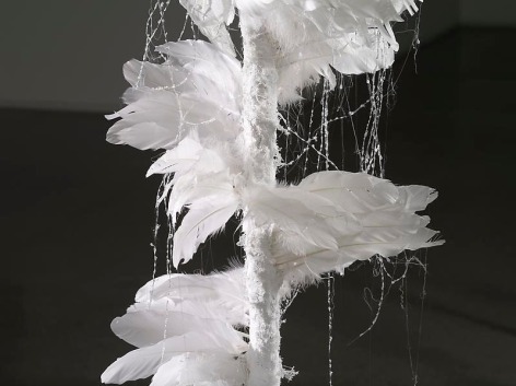 Minouk Lim. Portable Keeper_White (detail), 2012. Feather, fishing gut, glue, wood stick, paraffin, fan, plaster bandage, 200 x 50 cm (diameter).