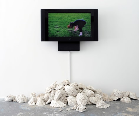 CAROLINE COVINGTON Beatings: Baltimore 2011, performance and installation with cast plaster, video, dirt, 84 x 120 x 36 inches. Installation view: ACADEMY 2011, Conner Contemporary Art.