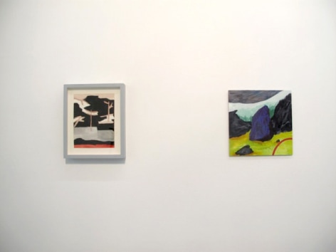 A photograph of 2 artworks hung on a white wall