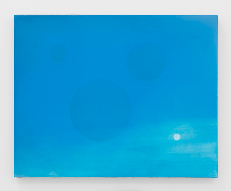 A painting on canvas. The majority is sky blue, and transitions to a paler hue toward the bottom-right. There are three spheres: 2 semi-large blue shapes in the center; at right is a small white circle.