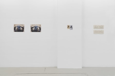 An installation view of 2 photographs, and 2 drawings, installed on the wall without frames