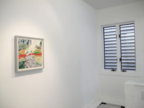 A photograph of one abstract painting and a window on the next wall
