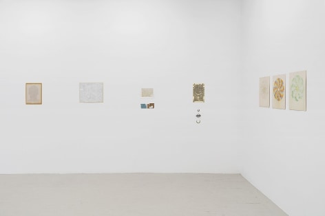 An installation image of 6 mixed media works on paper installed on the wall with no frames