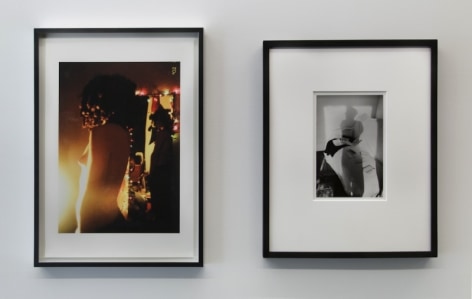 A photograph of 2 images in a row, framed in black. The left image is in color, the right is black and white
