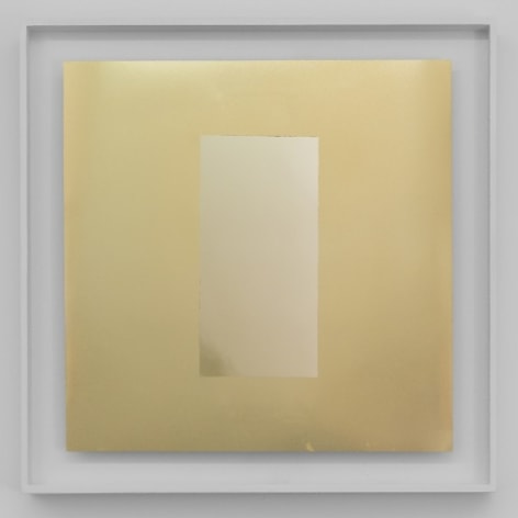 A square artwork that has a rectangle centrally situated on a gold ground. All surfaces are highly reflective. The work is framed in white.