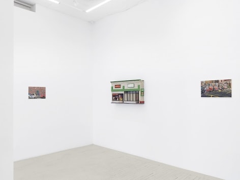 An installation image of 2 paintings and 1 sculpture hung on the wall by Nicholas Buffon hung
