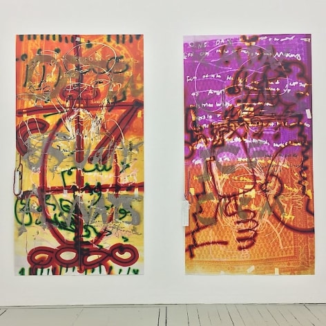 A photograph of two large vertical artworks. On the left the canvas is yellow at the bottom and more orange near the top. There are lines in silver, green, and red intersected with black. The work on the right has an orange and purple background with silver, red, and yellow lines over and throughout.