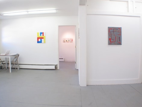 An image of 2 works (one in the main room at left, one in the hallway at right) and 3 more are visible through a doorway in the background