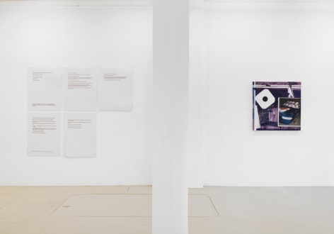 an installation view of the exhibition showing the text panels and a dark purple painting
