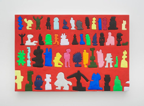 A photograph of a painting that has a red background and includes 4 rows of 10-14 figures&mdash;some are recognizable as idols like Buddha, King Kong, or an orthodox cross but others are more abstract.