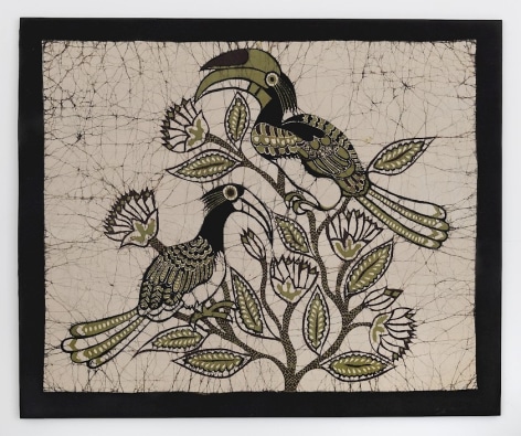 A textile with a black border; three hornbill birds are gathered in the middle of a beige background. They are green, black, and white in color, very graphic